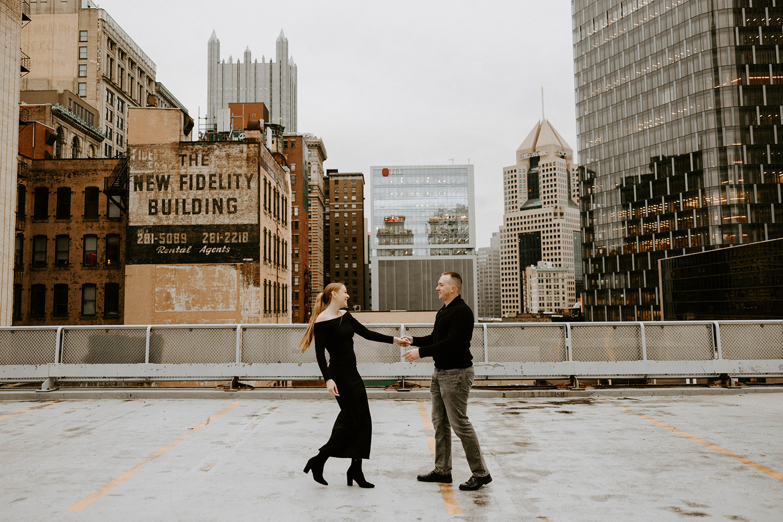 Couple smiling at each other and holding hands, taken by PA wedding photographer Lindsey Zern
