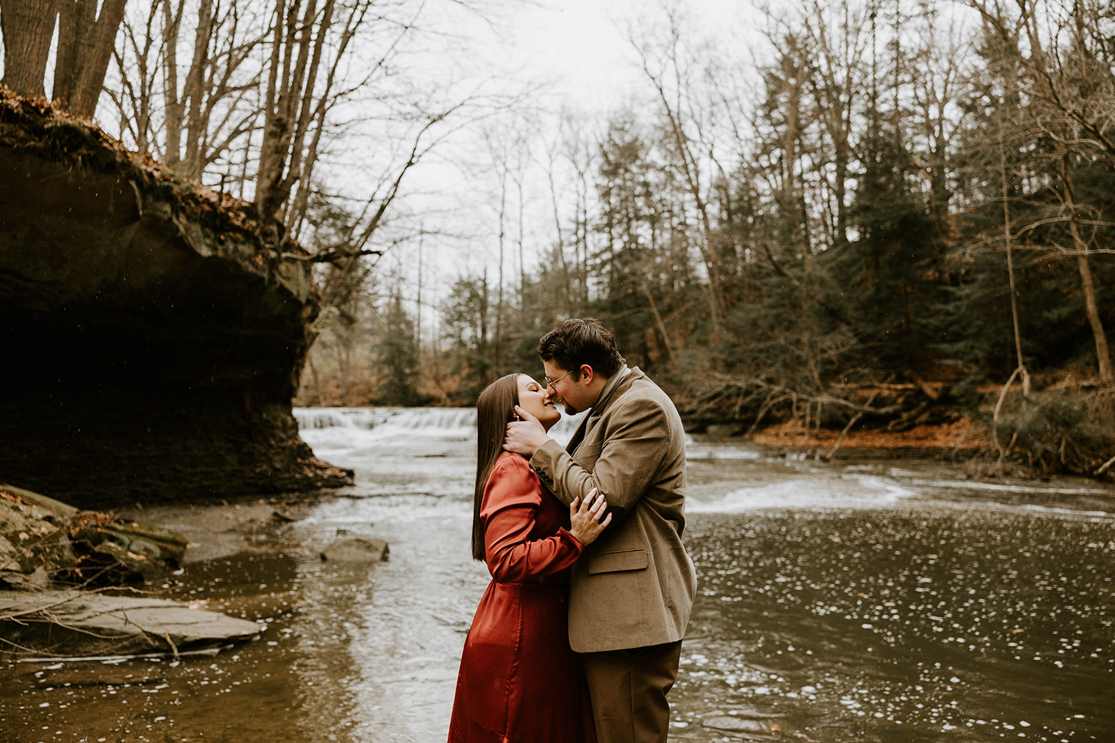 Couple leaning in for a kiss during their engagement shoot, captured by Lindsey Zern Photography