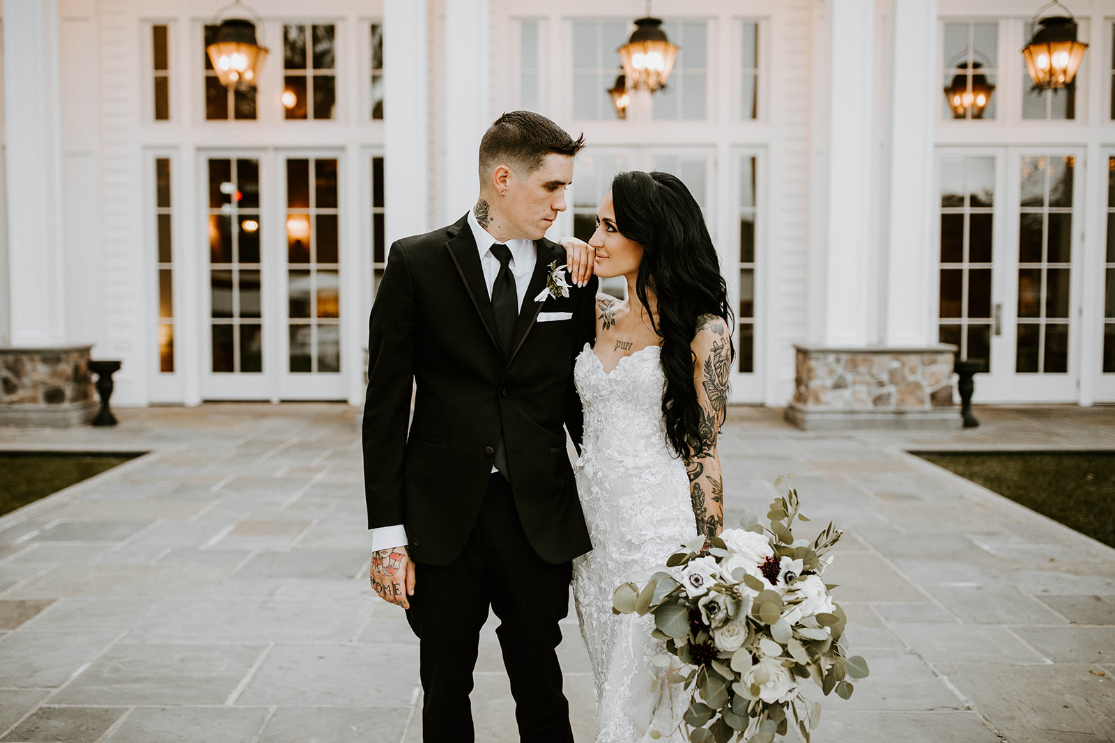 Bride and groom looking at each other as they pose during their Ryland Inn wedding shoot with Lindsey Zern Photography